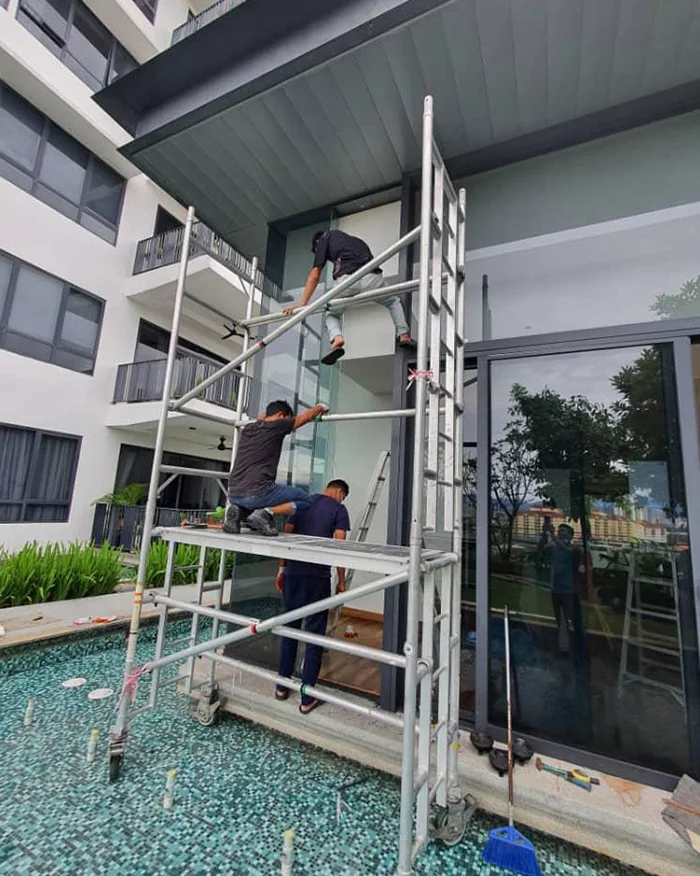 Working at height on a shopfront glass door
