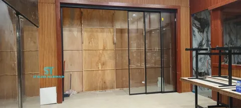 Slim Hanging Sliding Door — Trackless Sliding Door by ST Glass Aluminium thumbnail 1