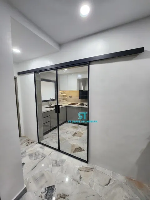 Slim Hanging Sliding Door — Trackless Sliding Door by ST Glass Aluminium thumbnail 1